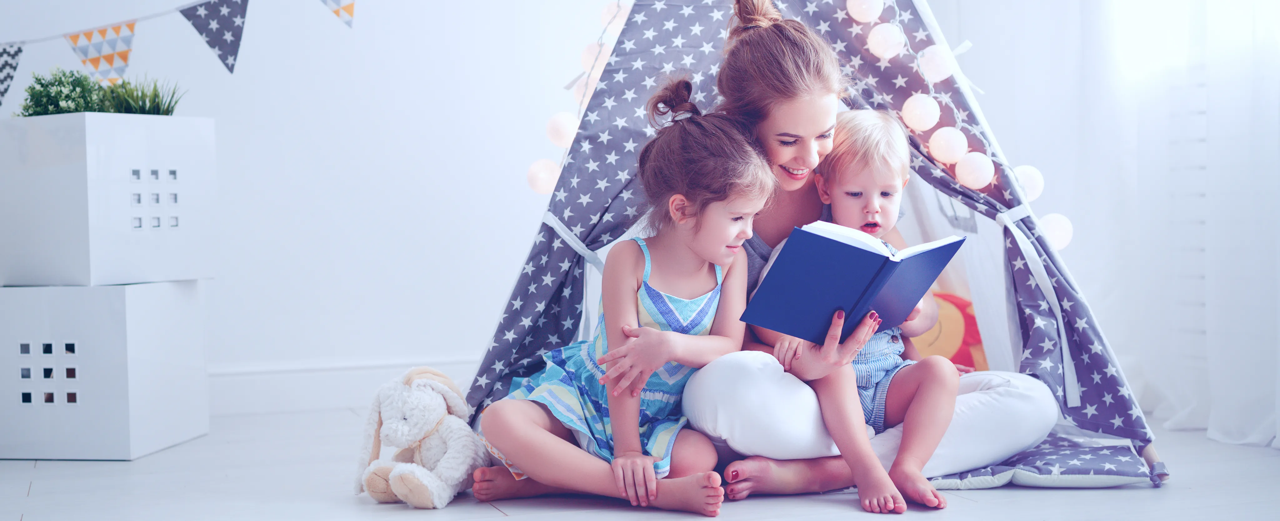 Woman and Kids Reading Baby Book